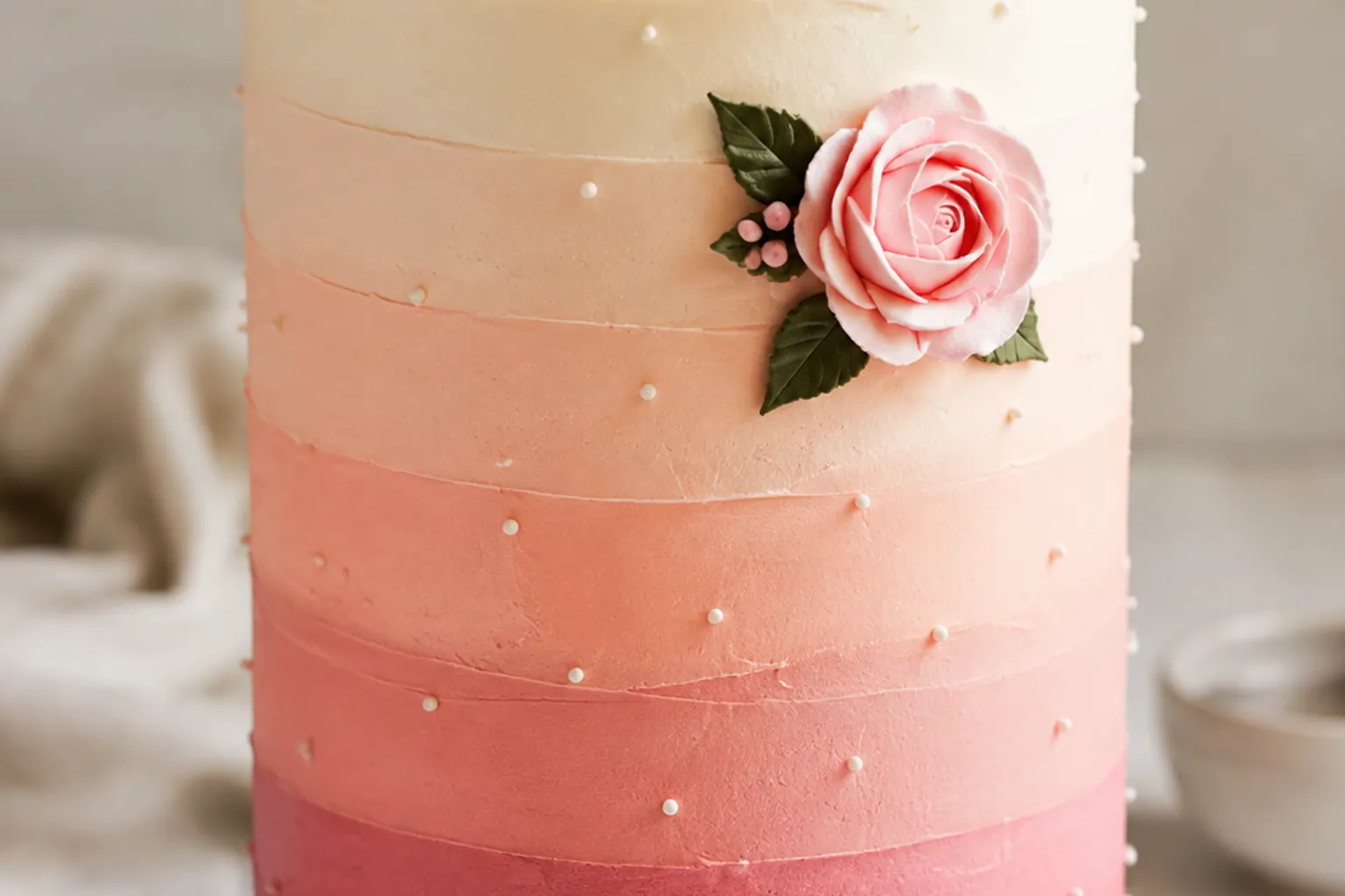 Close view of controlled cake color bands, restrained piping, and repeated surface texture