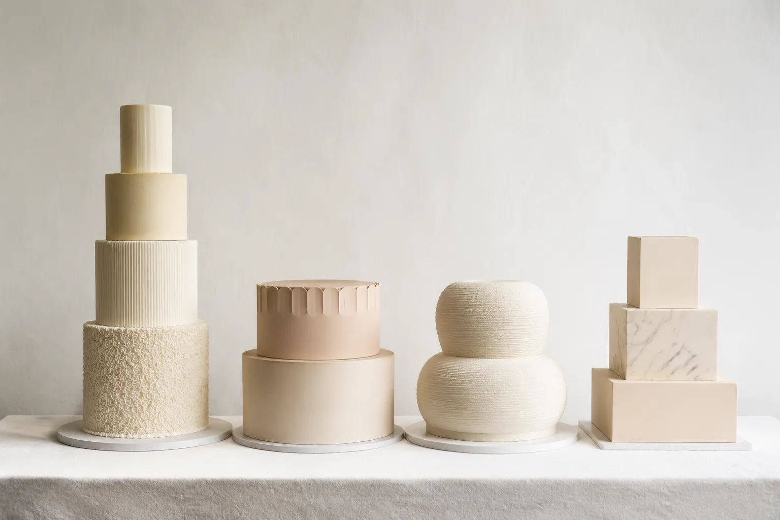 Cake silhouettes and tier proportions presented as contrasting visual forms