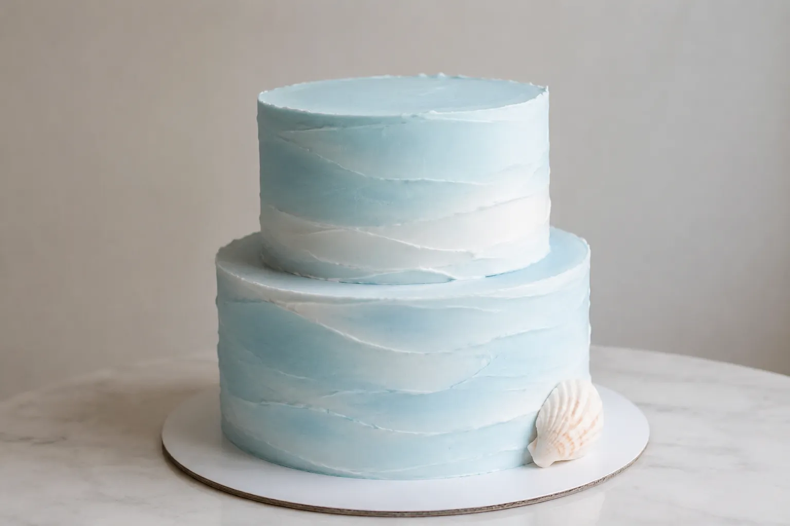 Restrained ocean themed cake with sparse details and open surface space